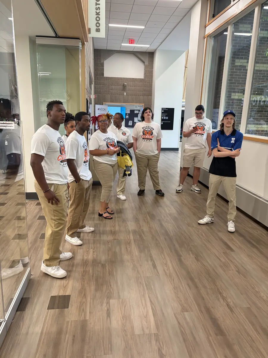 Students listening to a guide during a Minnesota campus visit.